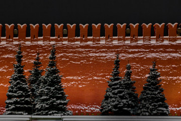 Moscow, the snow-covered Red Square, the Kremlin wall and the snow-covered spruce from it. stern...