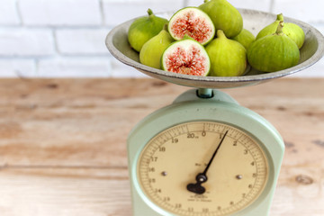 Antique kitchen scale and ripe figs