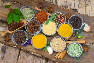 Variety of spices on wooden background