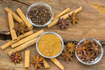 Variety of spices on wooden background
