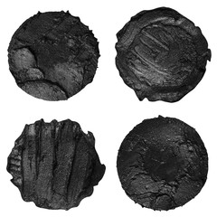 Set of four black paint samples isolated on a white background. Black round paint swatches