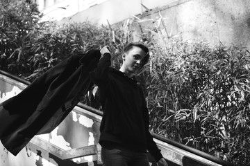 strong, laid back, cool girl, tomboy in black and white street style scene. Outdoor fashion images...