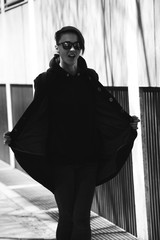 strong, laid back, cool girl, tomboy in black and white street style scene. Outdoor fashion images...