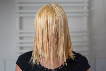 Naklejka premium Blond woman with shoulder length wet hair