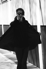 strong, laid back, cool girl, tomboy in black and white street style scene. Outdoor fashion images...