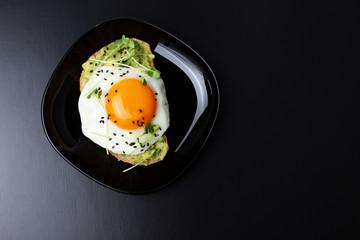 A toast with edd, avocado and mini greens