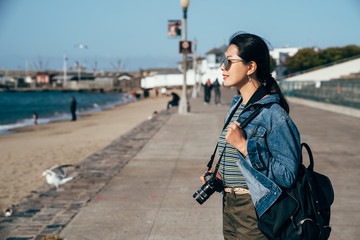 woman lens man holding camera smiling sightseeing