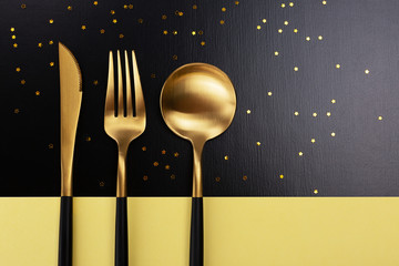Set of black and gold cutlery