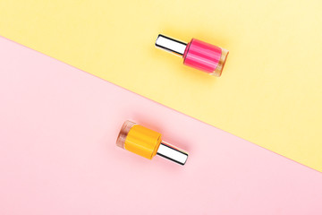 Nail polishes on colorful background