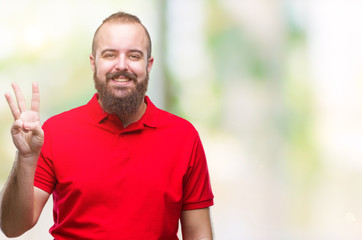Young caucasian hipster man wearing red shirt over isolated background showing and pointing up with fingers number three while smiling confident and happy.