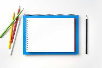 Top view of blue and red spiral notebook, page