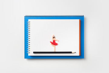Top view of blue and red spiral notebook, page