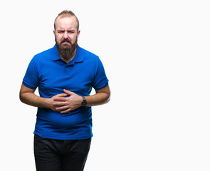 Young caucasian hipster man wearing blue shirt over isolated background with hand on stomach because indigestion, painful illness feeling unwell. Ache concept.