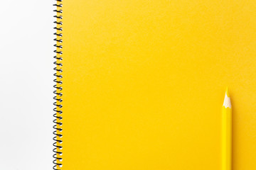 Top view of yellow spiral notebook, page