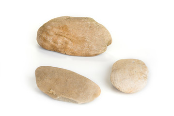 Fototapeta na wymiar Three pebble stones on a white background