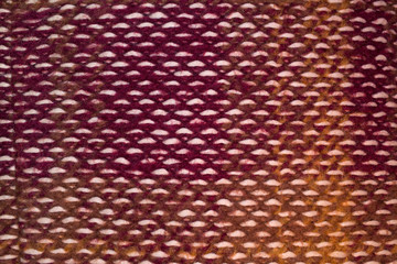 Warm knitted fabric texture. Warm color tones thick threads