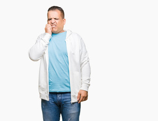 Fototapeta premium Middle age arab man wearing sweatshirt over isolated background looking stressed and nervous with hands on mouth biting nails. Anxiety problem.