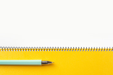Top view of yellow spiral notebook, page