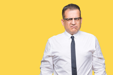 Middle age bussines arab man wearing glasses over isolated background skeptic and nervous, frowning upset because of problem. Negative person.