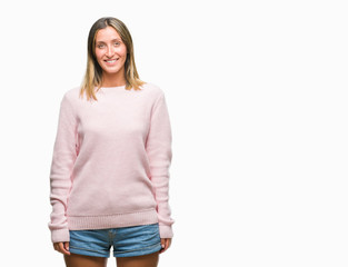 Obraz premium Young beautiful woman wearing winter sweater over isolated background with a happy and cool smile on face. Lucky person.
