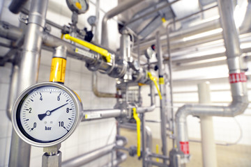 closeup Dial gauge for pressure testing in an industrial plant // Messuhr zur Druckprüfung in einer Industrieanlage  - obrazy, fototapety, plakaty