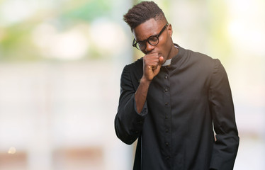 Young african american priest man over isolated background feeling unwell and coughing as symptom for cold or bronchitis. Healthcare concept.