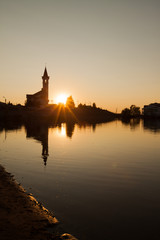 Fototapeta premium Mosque against the backdrop of beautiful sunset sky