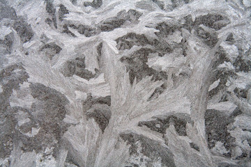 Texture of frosty patterns. Winter frosty patterns on the glass