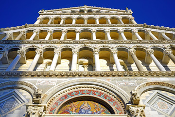 Exterior view of the Pisa Cathedral facade (Santa Maria Assunta) on the Square of Miracles (Piazza dei Miracoli) complex near the Leaning Tower of Pisa in Tuscany, Central Italy