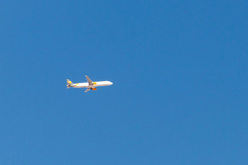 Airplane flying in the blue sky
