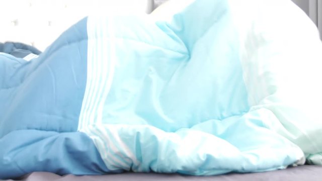 Slow motion of asian family mother and son having fun, playing hide and seek at home, 4K