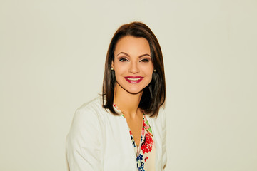 Portrait of an attractive female doctor in white coat.