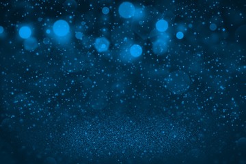 Obraz na płótnie Canvas light blue beautiful brilliant glitter lights defocused bokeh abstract background with sparks fly, holiday mockup texture with blank space for your content