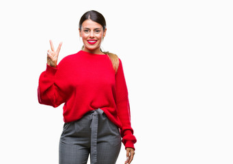 Young beautiful business woman wearing winter sweater over isolated background showing and pointing up with fingers number two while smiling confident and happy.