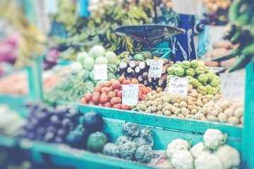 Market stall with tropical fruits and vegetables. Selective Focus.