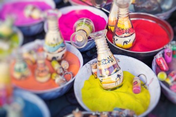 Souvenirs from Jordan - bottles with sand and shapes of desert and camels. Selective Focus.