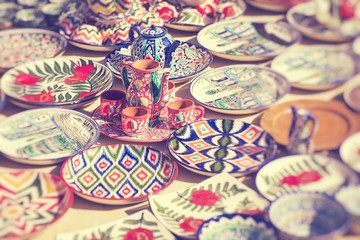 Plates and pots on a street market in Uzbekistan. Selective Focus.