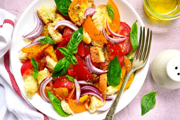 Panzanella - traditional italian tomato salad with bread and onion.Top view.