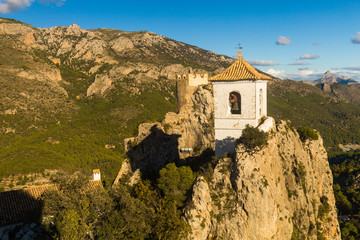 Fototapeta na wymiar The famous Bell Tower and Gateway at Guadalest near Benidorm in Spain, horizontal- travel background.