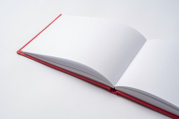 Perspective red notebook with open page