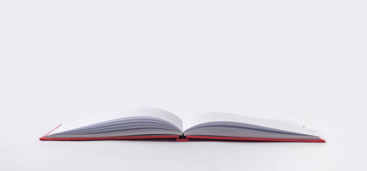Perspective red notebook with open page