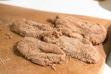 Raw schnitzel ready to be cooked.