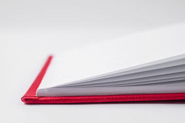 Perspective red notebook with open page