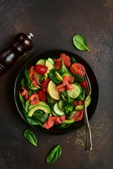 Fresh vegetable salad with salted salmon.Top view with copy space.