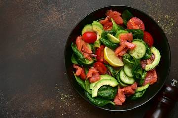 Fresh vegetable salad with salted salmon.Top view with copy space.