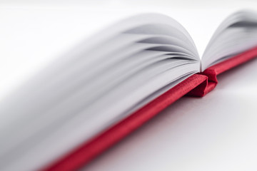 Perspective red notebook with open page