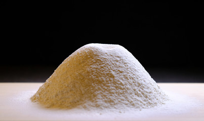 A pile of sifted flour on the kitchen table