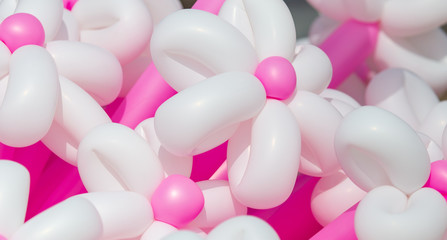 Multicolored flowers from balloons as background