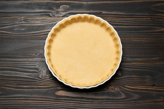 shortbread dough for baking quiche tart in baking form