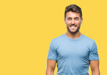 Young handsome man over isolated background with a happy and cool smile on face. Lucky person.